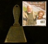 Advertising copper bell – “Ring for the Dairy Products Company” on one side, a cow on opposing long