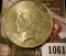 1061 . 1926 Peace Silver Dollar, AU, value $37