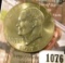 1076 . 1977-D Eisenhower Dollar, BU toned from a Mint Set, MS63 val