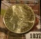 1037 . 1881-S Morgan Silver Dollar, BU, MS63+, MS63 value $65, MS64