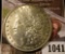 1041 . 1885 Morgan Silver Dollar, AU+, light wear, value $39