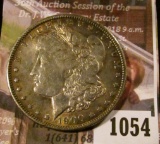 1054 . 1900-O Morgan Silver Dollar, AU toned, reverse has old bulls
