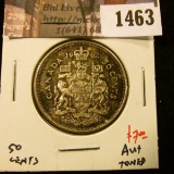 1463 . 1962 Canada 50 Cents, AU+ toned, value $7