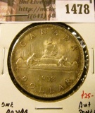 1478 . 1952 Canada Silver Dollar, AU+ toned, value $25+