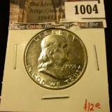 1004 . 1951 Franklin Half Dollar, AU, value $12