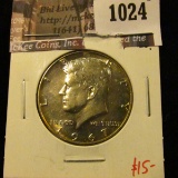 1024 . 1967 Kennedy Half Dollar, BU bulls eye / peripheral toned, v