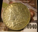 1040 . 1884 Morgan Silver Dollar, VF/XF, value $35
