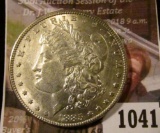 1041 . 1885 Morgan Silver Dollar, AU+, light wear, value $39