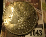 1043 . 1886 Morgan Silver Dollar, AU+, value $39