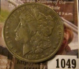 1049 . 1892-O Morgan Silver Dollar, VF, value $40
