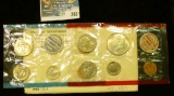 1969 U.S. Mint Set in original envelope and cellophane as issued. Includes Silver Half Dollar.