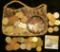 An interesting Sequined Zippered Purse with a bracelet & a variety of Foreign Coins.