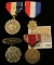 1497 _ Group of Four medals dating back to 1909 and including both an Ottumwa Medal and military ser