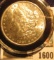 1600 _ 1887 P Brilliant Uncirculated Morgan Silver Dollar stored in an Airtight holder.