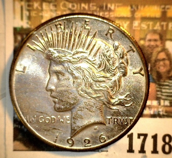 1718 _ 1926 P U.S. Silver Peace Dollar, Choice BU 64. Gold toning.