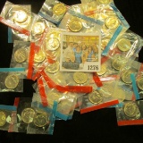 1276 _ (50) 1965-78 U.S Mint Single Roosevelt Dimes in original U.S. Mint Cellophane as cut from Min