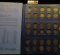 1857-1909 Partial Set of Indian Head Cents in a blue Whitman folder. Includes three Flying Eagle Cen