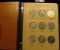 Complete Set of 1971-78 Eisenhower Dollars in a World Coin Library Album. Contains all the Silver, U
