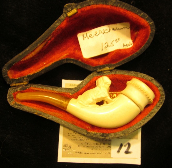 "Warranted Genuine Meerschaum" miniature pipe in pipe case. Small dog on stem proximal to bowl.