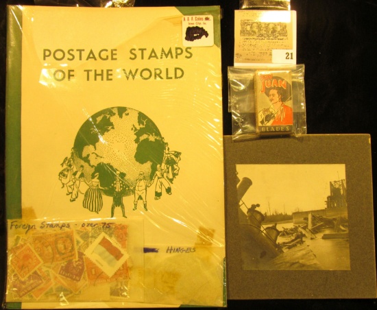 Album "Postage Stamps of the World" with stamps & hinges.; B & W mounted photo of a Rail Road Bridge
