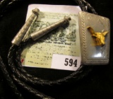 Western Style Bolo Tie with Golden Steer on engraved background.