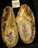 Pair of Beaded leather and fur Moccasins. 