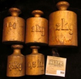 Five-piece Set of Heavy Brass Weights, which includes (2) 0.5 KG, (2) 1 Kg, & a 2 Kg. Stored in a li