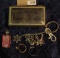 1539 _ Small Silvered Jewelry Box containing a couple of rings, a Pink faceted Pendant, & a Charm Ke