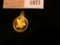 1071 _ Small Felt Bag with a 1985 Iowa Hawkeyes 1/10 oz. Proof Gold Piece depicting Herky the Hawk i