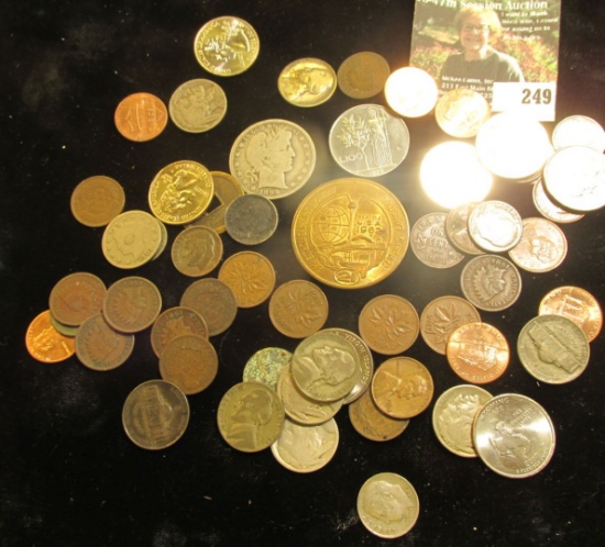 A nice accumulation of U.S. Coins, Canada Coins, and even a medal. Includes a Silver Barber Half Dol