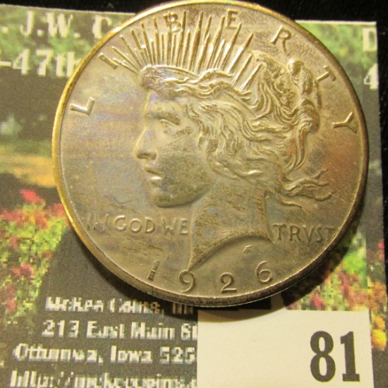 1926 P U.S. Silver Peace Dollar, Choice BU 64. Gold toning.