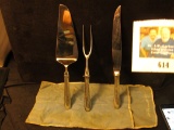 Three-Piece Serving Set Pie Server, Meat Fork, & Knife. The Pie Server says 