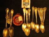 Red Ladies Compact & a group of Silver Plated Collector's Spoons.