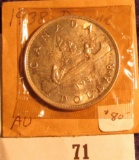 1938 Canada Silver Dollar, lightly toned AU.