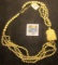 Four-strand Necklace with an offset handcarved Owl Head, all Ivory except some silver beads and the