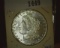 1883 O U.S. Morgan Silver Dollar Semi-prooflike, Gem BU, with light toning areas.