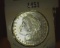1883 O U.S. Morgan Silver Dollar Semi-prooflike, Gem BU, with hints of gold toning.