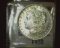 1885 O U.S. Morgan Silver Dollar, Brilliant Uncirculated.
