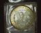 1887 P U.S. Morgan Silver Dollar, Gem Brilliant Uncirculated with spectacular Gold toning.