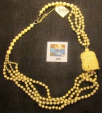 Four-strand Necklace with an offset handcarved Owl Head, all Ivory except some silver beads and the