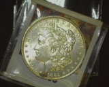 1884 O U.S. Morgan Silver Dollar, Brilliant Uncirculated. Just a hint of edge toning.