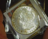 1885 P U.S. Morgan Silver Dollar, Brilliant Uncirculated. Hints of Gold toning.