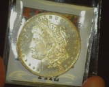 1884 O U.S. Morgan Silver Dollar, Gem Brilliant Uncirculated. Hints of Gold toning.