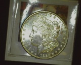 1886 P U.S. Morgan Silver Dollar, Brilliant Uncirculated with scattered toning.