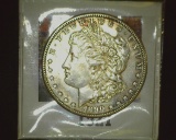 1890 S U.S. Morgan Silver Dollar, Uncirculated with moderate toning.