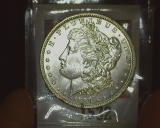 1890 O U.S. Morgan Silver Dollar, Brilliant Uncirculated. With a touch of toning.