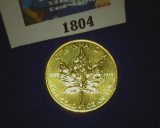 1985 Canada $50 .9999 Fine Gold One Ounce Coin in a royal blue velvet-lined box. Brilliant Uncircula