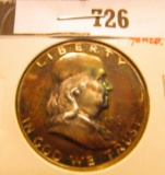 1961 P Proof toned Franklin Half Dollar.