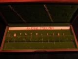 Wooden, flet-lined Display Box containing (11) Different Antique Stick Pins. Doc had these priced to