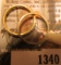 1340.           Pair of very Similar design 18K Gold Wedding bands. 5.9 grams total weight.